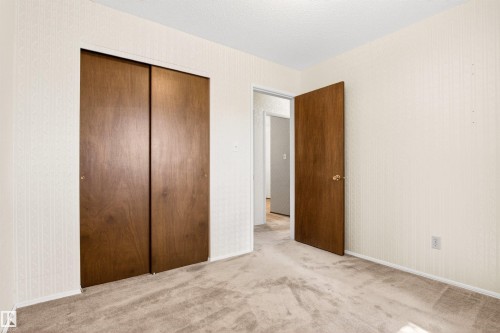 Neutral-toned carpeting paired with light-colored walls - 29 Bristow Crescent, Spruce Grove, AB - Indoor Photo Showing Other Room