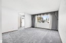 Spacious room with gray carpet flooring and white walls - 29 Bristow Crescent, Spruce Grove, AB  - Indoor Photo Showing Other Room 