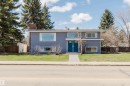 Split-level residence featuring blue siding, white trim, and a prominent chimney - 3752 114 Street, Edmonton, AB  - Outdoor With Facade 