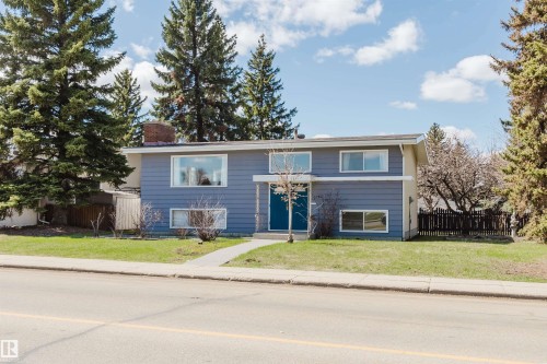 Split-level residence featuring a blue siding exterior and white trim - 3752 114 Street, Edmonton, AB - Outdoor With Facade