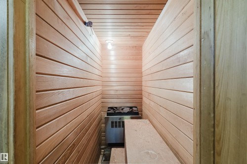 Interior sauna featuring horizontal wood paneling, a built-in electric heater, and integrated wooden benches - 3752 114 Street, Edmonton, AB - Indoor Photo Showing Other Room