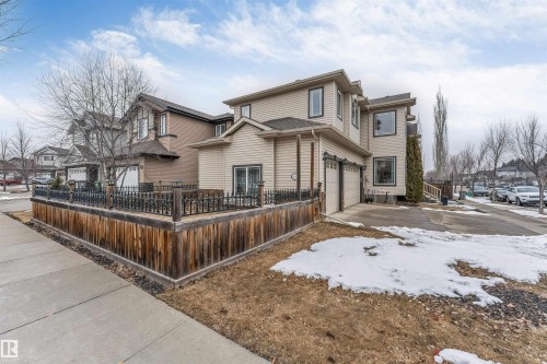 The property features a two-story design with light-colored siding and a dark roof - 6002 46 Avenue, Beaumont, AB - Outdoor