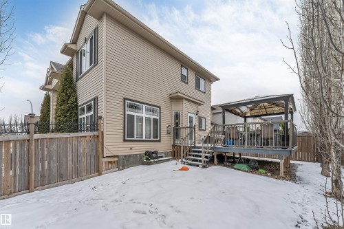 This property features a spacious deck with a gazebo, offering an outdoor living area - 6002 46 Avenue, Beaumont, AB - Outdoor With Deck Patio Veranda