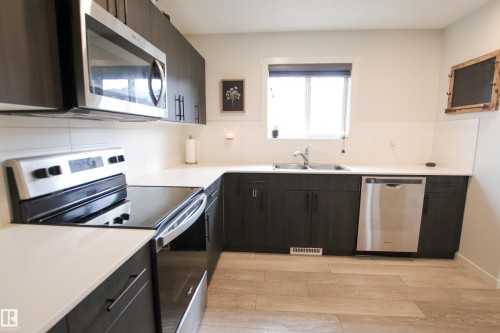 2509 14 Avenue, Edmonton, AB - Indoor Photo Showing Kitchen With Double Sink