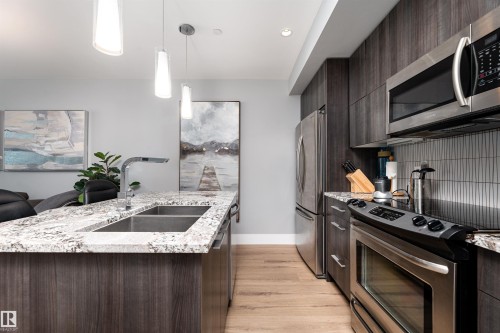 1404 11969 Jasper Avenue, Edmonton, AB - Indoor Photo Showing Kitchen With Stainless Steel Kitchen With Double Sink With Upgraded Kitchen