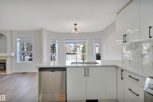 4124 37A Avenue, Edmonton, AB - Indoor Photo Showing Kitchen With Fireplace With Upgraded Kitchen