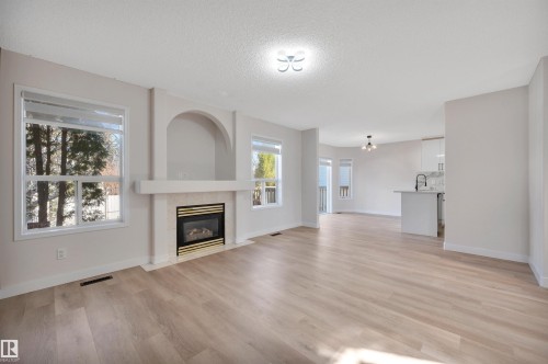 4124 37A Avenue, Edmonton, AB - Indoor Photo Showing Living Room With Fireplace