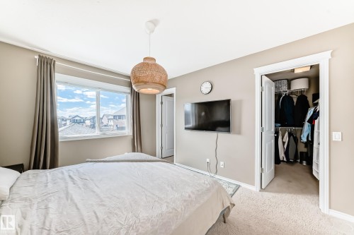 Room with neutral-toned walls and plush carpeting - 5020 Orchards Gate, Edmonton, AB - Indoor Photo Showing Bedroom