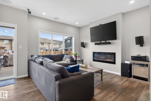 7515 Elmer Bend, Edmonton, AB - Indoor Photo Showing Living Room With Fireplace