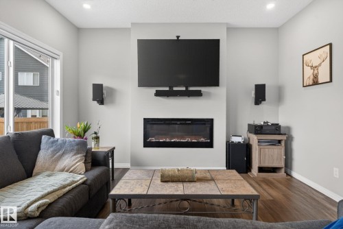 7515 Elmer Bend, Edmonton, AB - Indoor Photo Showing Living Room With Fireplace