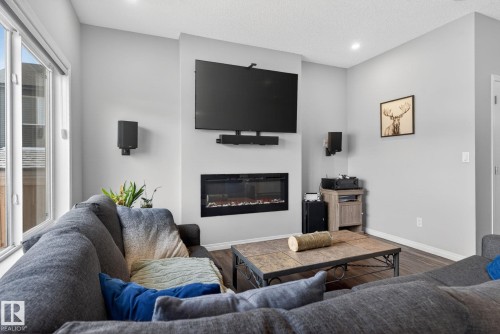 7515 Elmer Bend, Edmonton, AB - Indoor Photo Showing Living Room With Fireplace