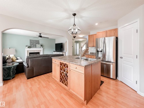 36 Eastgate Way, St. Albert, AB - Indoor Photo Showing Kitchen With Fireplace With Double Sink