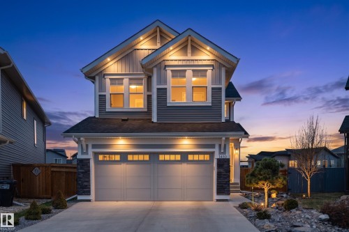 Modern residential exterior with gray siding and stone accents - 1450 Darby Green, Edmonton, AB - Outdoor