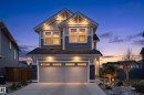 Modern residential exterior with gray siding and stone accents - 1450 Darby Green, Edmonton, AB  - Outdoor 