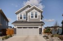 Contemporary two-story residence featuring a gray and white exterior with diverse siding textures - 1450 Darby Green, Edmonton, AB  - Outdoor 
