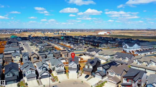 Aerial perspective of a residential neighborhood featuring multiple detached homes with varying architectural styles - 1450 Darby Green, Edmonton, AB - Outdoor With View