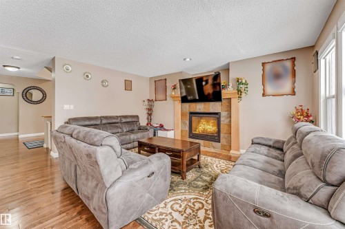 3236 26 Avenue, Edmonton, AB - Indoor Photo Showing Living Room With Fireplace