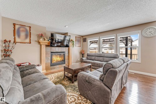 3236 26 Avenue, Edmonton, AB - Indoor Photo Showing Living Room With Fireplace