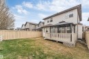 Expansive backyard featuring a wood privacy fence, a multi-level deck, and a detached gazebo - 3236 26 Avenue, Edmonton, AB  - Outdoor With Deck Patio Veranda 
