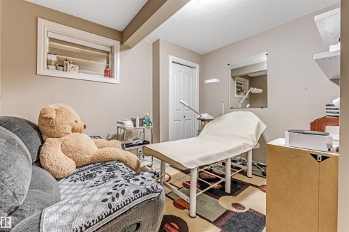 Versatile room featuring neutral wall tones and a window with horizontal blinds - 3236 26 Avenue, Edmonton, AB - Indoor