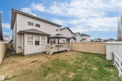 Expansive backyard featuring a wood deck with an attached gazebo, a fully fenced perimeter, and a detached storage shed - 3236 26 Avenue, Edmonton, AB - Outdoor