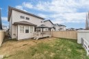 Expansive backyard featuring a wood deck with an attached gazebo, a fully fenced perimeter, and a detached storage shed - 3236 26 Avenue, Edmonton, AB  - Outdoor 