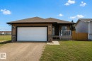 Ranch-style exterior with tan siding and dark trim - 5121 52 Ave, St. Paul Town, AB  - Outdoor 