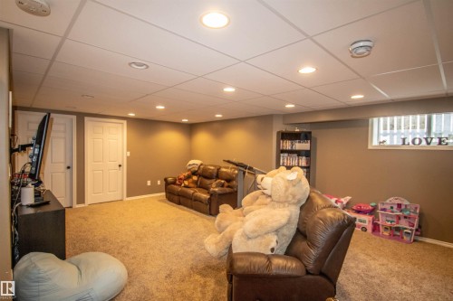 Finished lower level featuring recessed lighting, a drop ceiling, and neutral-toned carpeting - 5121 52 Ave, St. Paul Town, AB - Indoor Photo Showing Other Room