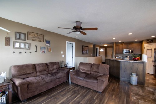 Open-concept living area featuring wood-finish flooring, a ceiling fan, and recessed lighting - 5121 52 Ave, St. Paul Town, AB - Indoor Photo Showing Living Room