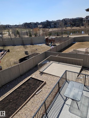 Upper-level deck with black metal railing - 4125 Kennedy Green, Edmonton, AB - Outdoor