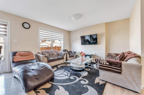 Bright living area featuring light wood-finish flooring - 1715 27 Street, Edmonton, AB - Indoor Photo Showing Living Room