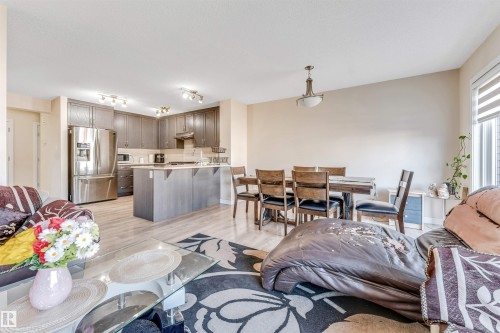 Open-concept living area with wood-finish flooring - 1715 27 Street, Edmonton, AB - Indoor