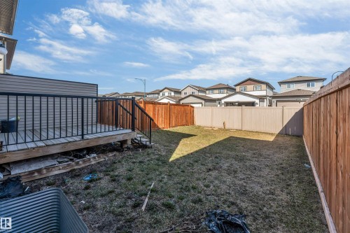 Rear deck with black metal railings and stairs - 1715 27 Street, Edmonton, AB - Outdoor
