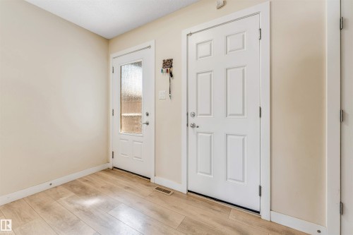 Entryway featuring light wood-finish flooring and neutral wall tones - 1715 27 Street, Edmonton, AB - Indoor Photo Showing Other Room