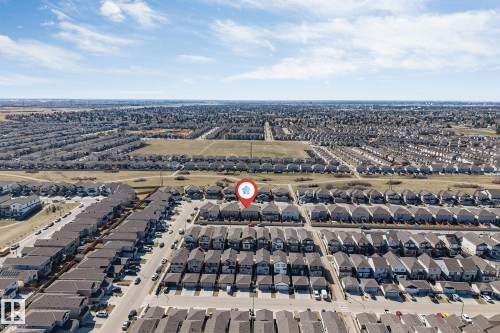 Aerial perspective showcasing a residential development with multiple housing units - 1715 27 Street, Edmonton, AB - Outdoor With View
