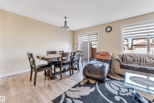Open concept living area featuring light wood-finish flooring - 1715 27 Street, Edmonton, AB - Indoor