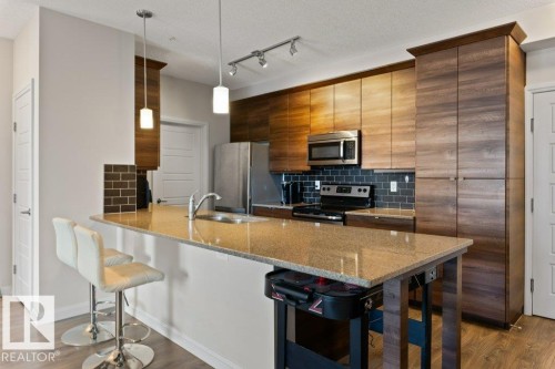 216 2588 Anderson Way, Edmonton, AB - Indoor Photo Showing Kitchen With Stainless Steel Kitchen With Upgraded Kitchen