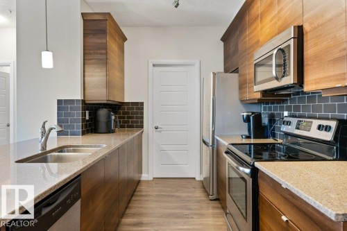 216 2588 Anderson Way, Edmonton, AB - Indoor Photo Showing Kitchen With Stainless Steel Kitchen With Double Sink With Upgraded Kitchen