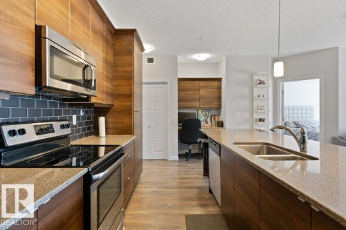 216 2588 Anderson Way, Edmonton, AB - Indoor Photo Showing Kitchen With Stainless Steel Kitchen With Double Sink With Upgraded Kitchen