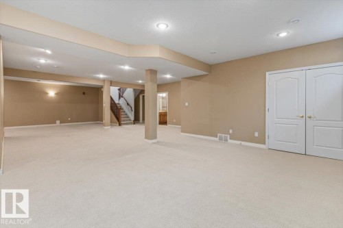 Expansive lower level with plush carpeting and neutral wall tones - 7719 166 Avenue, Edmonton, AB - Indoor