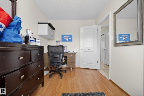 Light-toned walls with wood-finish flooring - 8312 29 Ave Nw, Edmonton, AB - Indoor