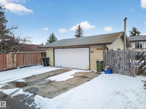 Attached single-car garage with a concrete driveway - 8312 29 Ave Nw, Edmonton, AB - Outdoor With Exterior