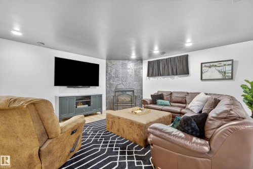 8705 92A Avenue, Edmonton, AB - Indoor Photo Showing Living Room With Fireplace