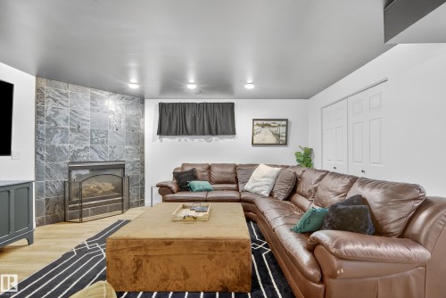 8705 92A Avenue, Edmonton, AB - Indoor Photo Showing Living Room With Fireplace