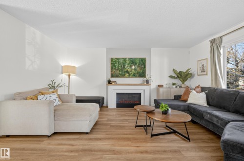 8705 92A Avenue, Edmonton, AB - Indoor Photo Showing Living Room With Fireplace