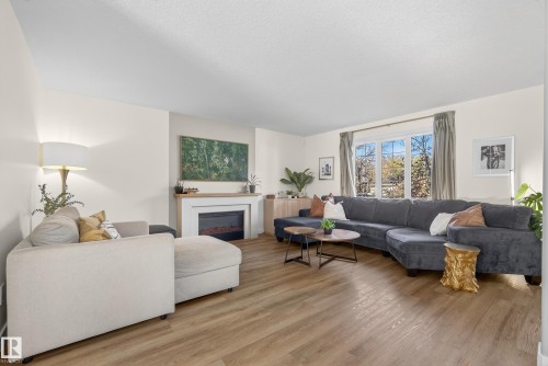 8705 92A Avenue, Edmonton, AB - Indoor Photo Showing Living Room With Fireplace