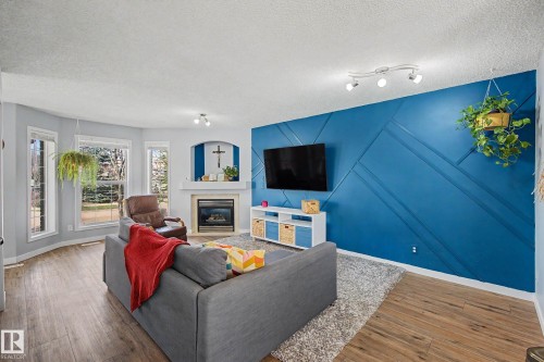 15 5281 Terwillegar Boulevard, Edmonton, AB - Indoor Photo Showing Living Room With Fireplace