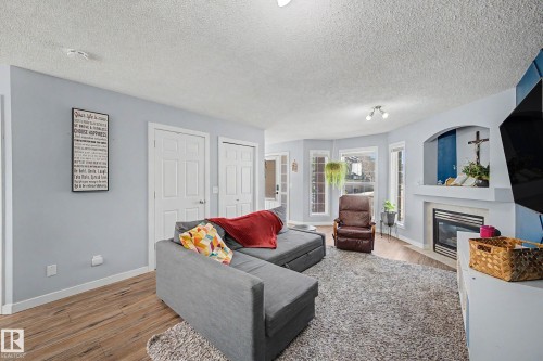 15 5281 Terwillegar Boulevard, Edmonton, AB - Indoor Photo Showing Living Room With Fireplace