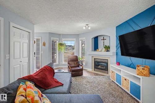 15 5281 Terwillegar Boulevard, Edmonton, AB - Indoor Photo Showing Living Room With Fireplace