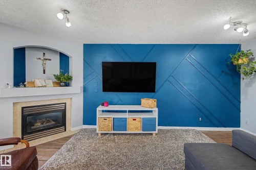 15 5281 Terwillegar Boulevard, Edmonton, AB - Indoor Photo Showing Living Room With Fireplace